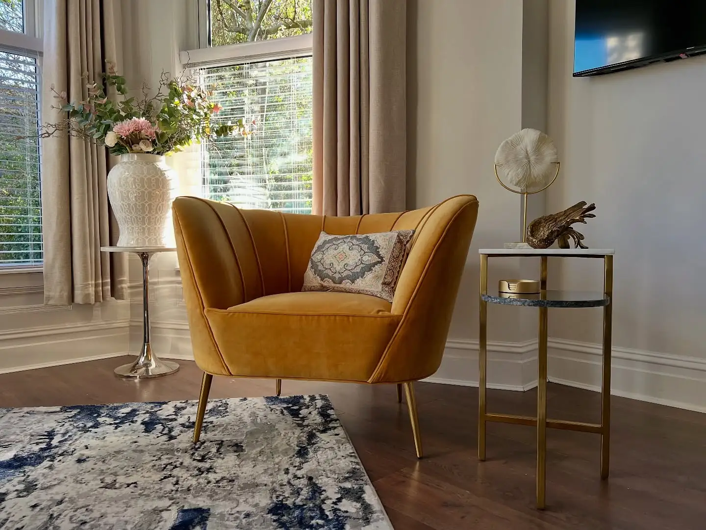 Mustard velvet chair by the window
